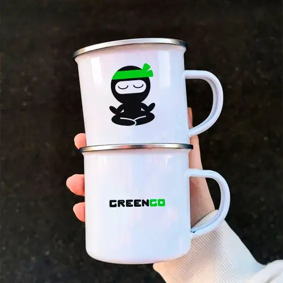 Two white steel cups with GreenGo branding.