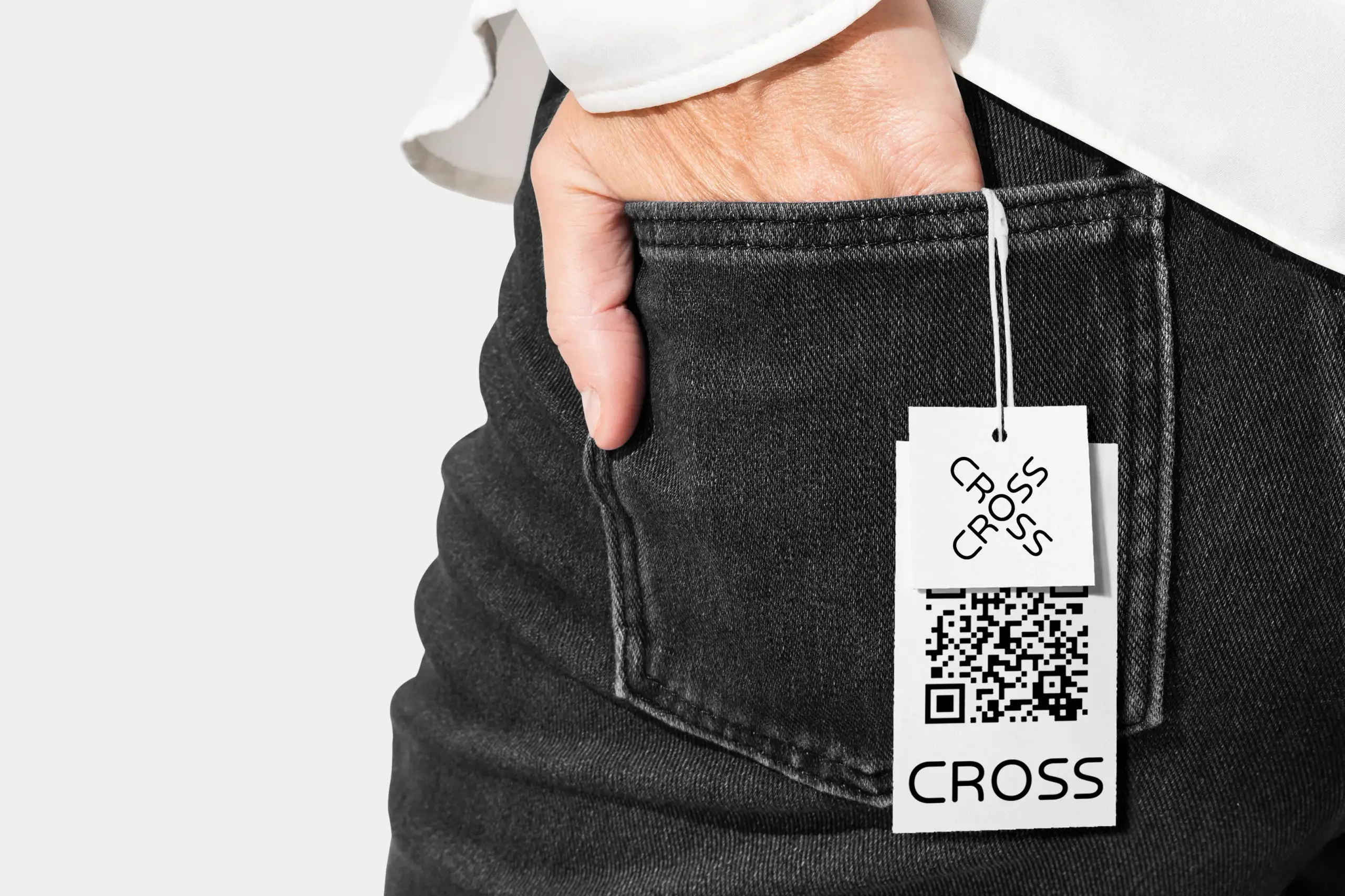 Denim jeans featuring Cross brand labels and scannable QR codes.