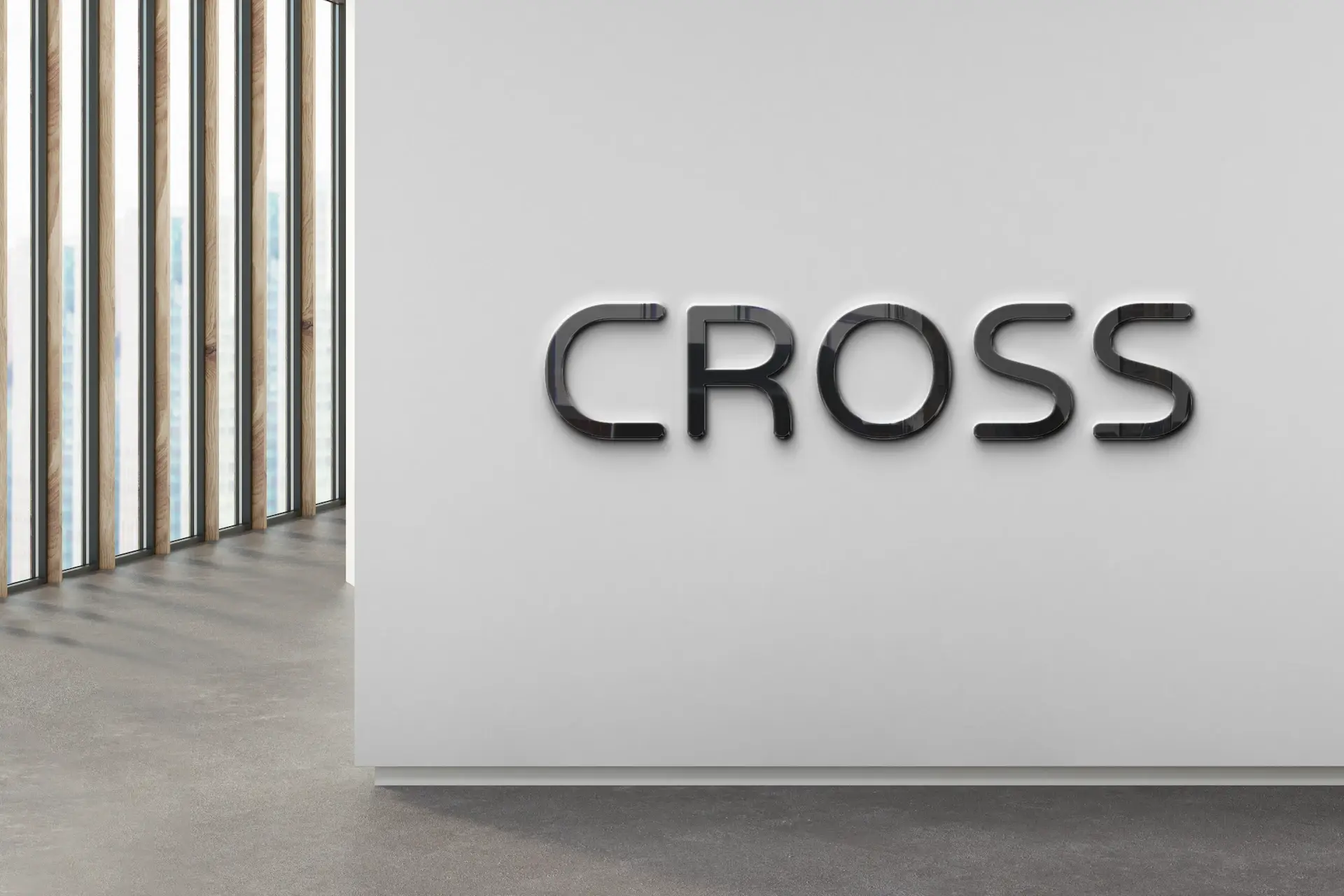 Cross wordmark logo on a wall of a retail store.