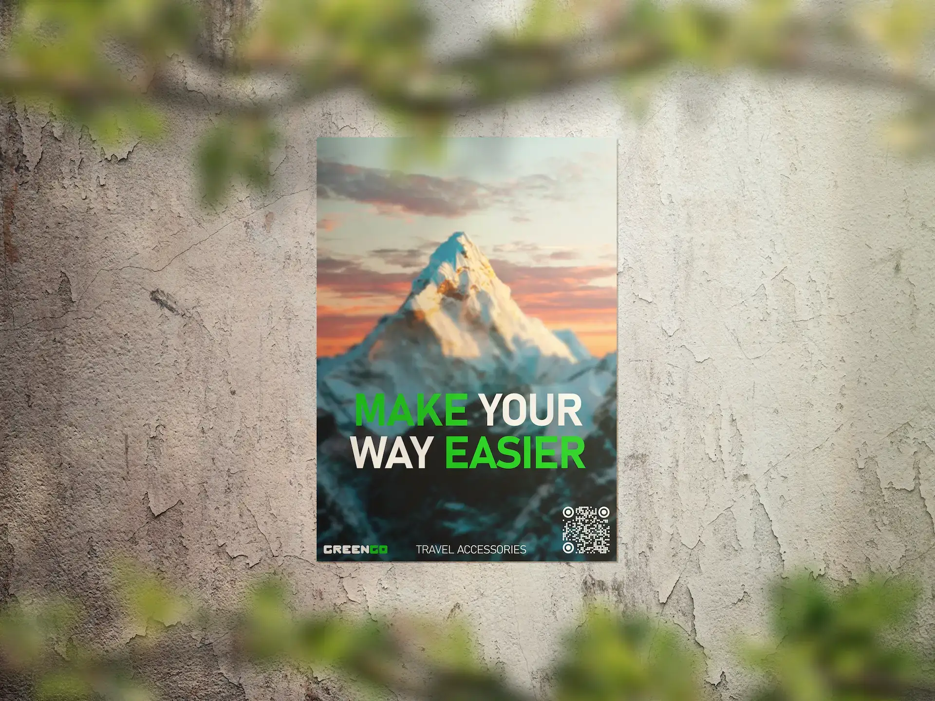 GreenGo mountain landscape poster with 'MAKE YOUR WAY EASIER' text, QR code, and 'TRAVEL ACCESSORIES' phrase.